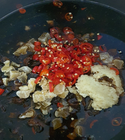 All ingredients placed into the pot except the mangoes